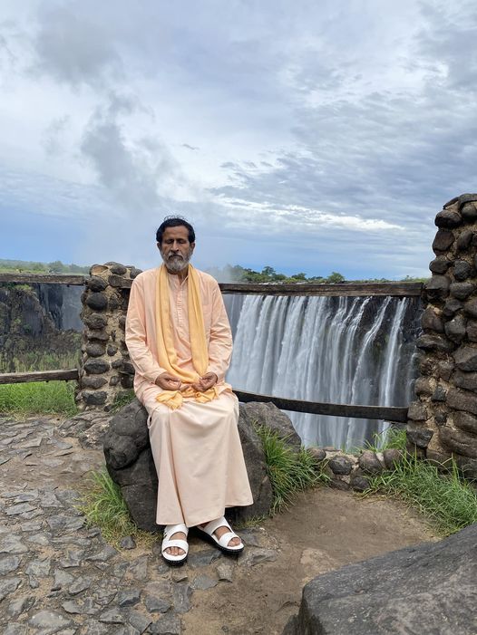 Bodhi meditating in front of Victoria Falls